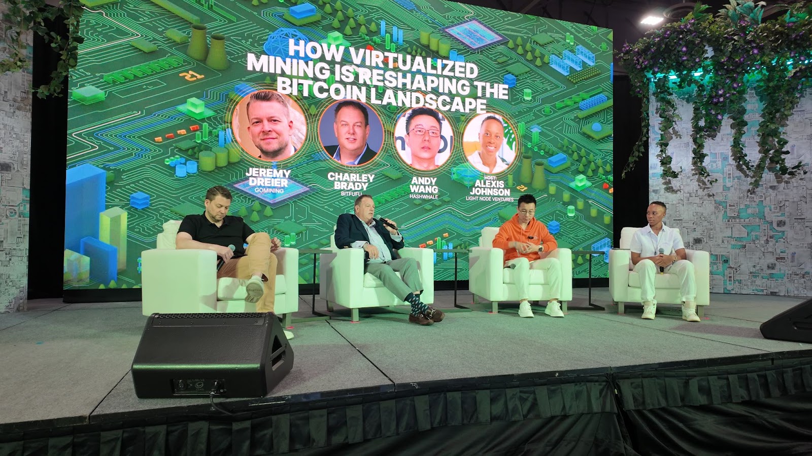 A group of men sitting on a stage

AI-generated content may be incorrect.
